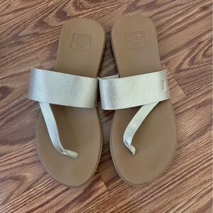 Reef sandals with gold straps